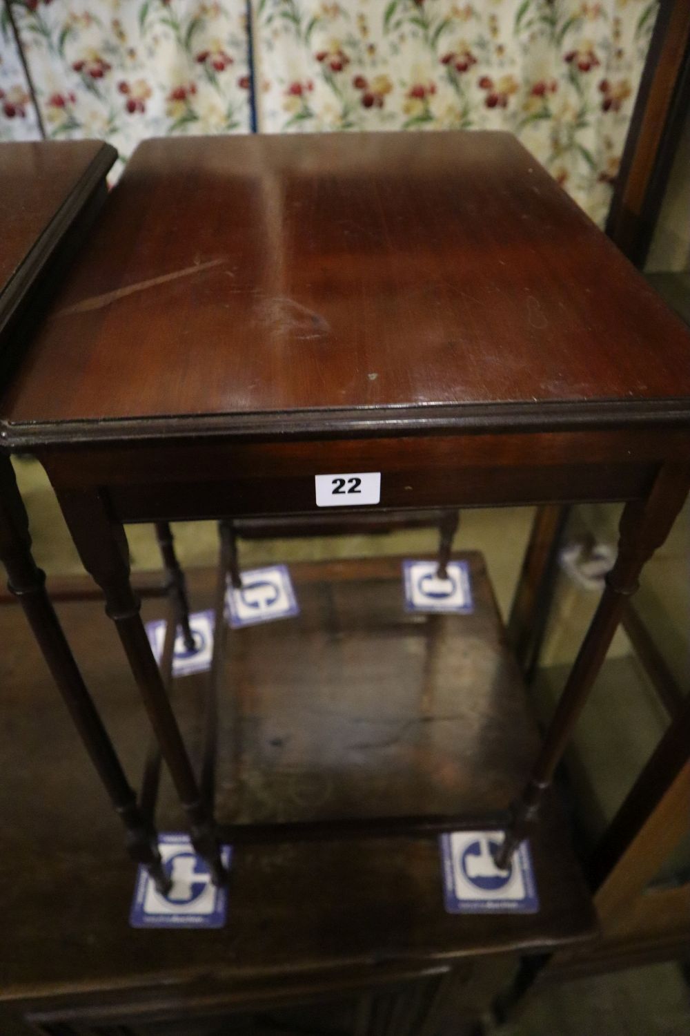 An Edwardian nest of three mahogany tea tables, width 51cm depth 36cm height 61cm